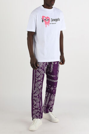 מכנסיים ארוכים עם הדפס בנדנה רטרו בגווני סגול ולבן PALM ANGELS